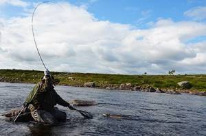 In a moment, a large fish will be in the landing net, and it will be possible to take a photo of the brown trout