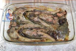 Carp baked in the oven with potatoes