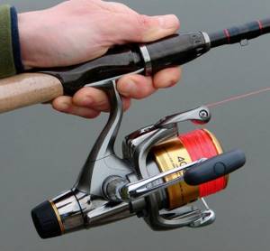 The reel is attached to the spinning rod