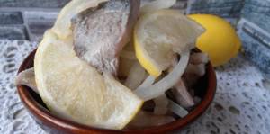 cod pieces with onion and lemon slices