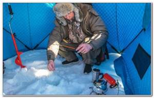 fishing in a tent in winter