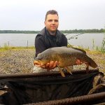 carp fishing in a pond in July