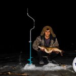 Catching pike in winter at night