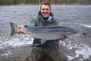 Mikhail Saransky is the happy owner of a trophy caught in June on the Kola River, Murmansk region
