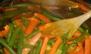 Boil carrots and beans