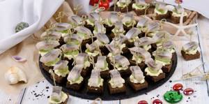 serving herring and canapés