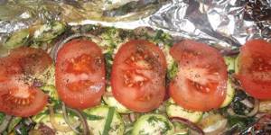 Fish with vegetables in the oven on foil