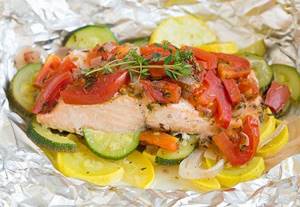 Salmon with vegetables in foil