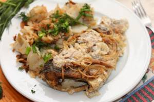 Pike perch with potatoes in sour cream sauce photo