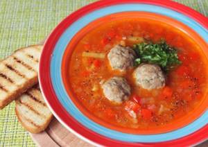 Soup with fish balls in tomato sauce