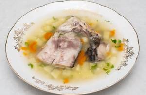 Headless sea bass soup. Recipe with millet, cream, rice, egg in a slow cooker, oven, pot 