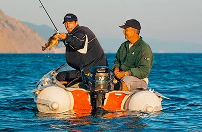 choosing a fishing spot from a boat