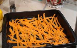 line a baking sheet with carrots
