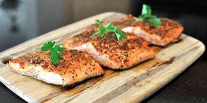 Baked salmon fillet on a cutting board